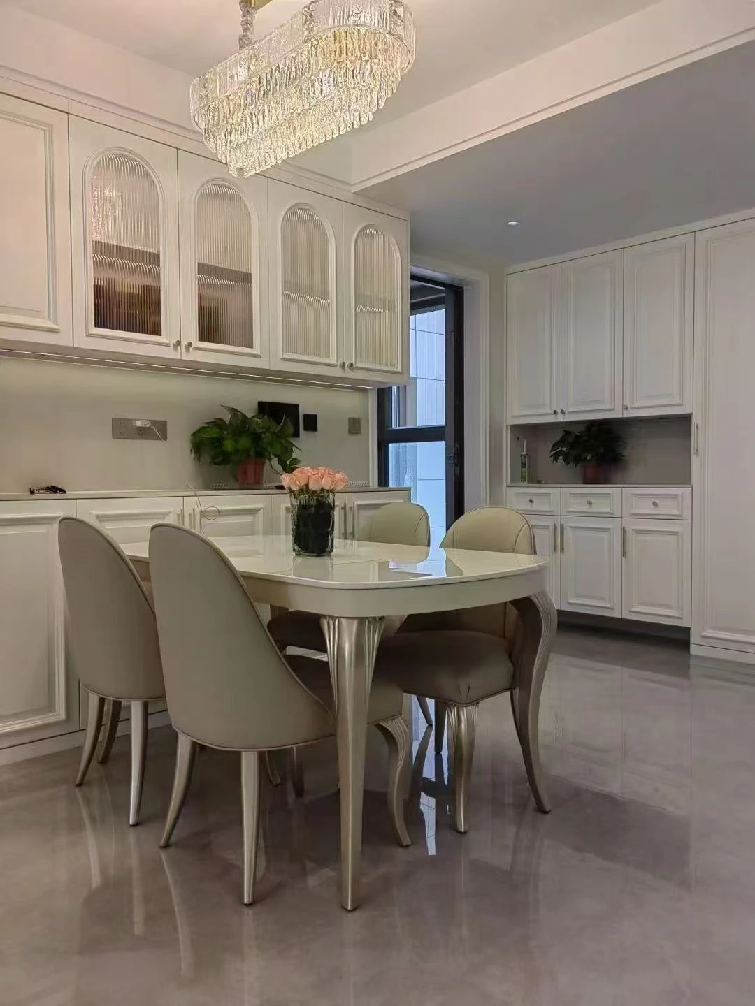 White dining table set with four chairs