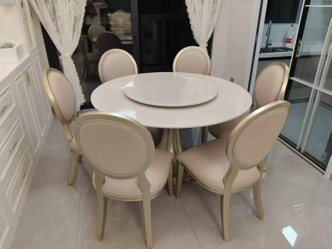 Round white dining table set with six chairs